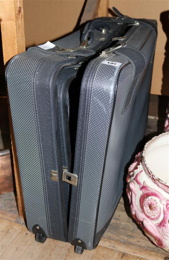 Three black suitcases